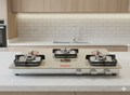 3 burner beige colour prmeium gas cooktop with 5g brass burners and 3 years warranty.